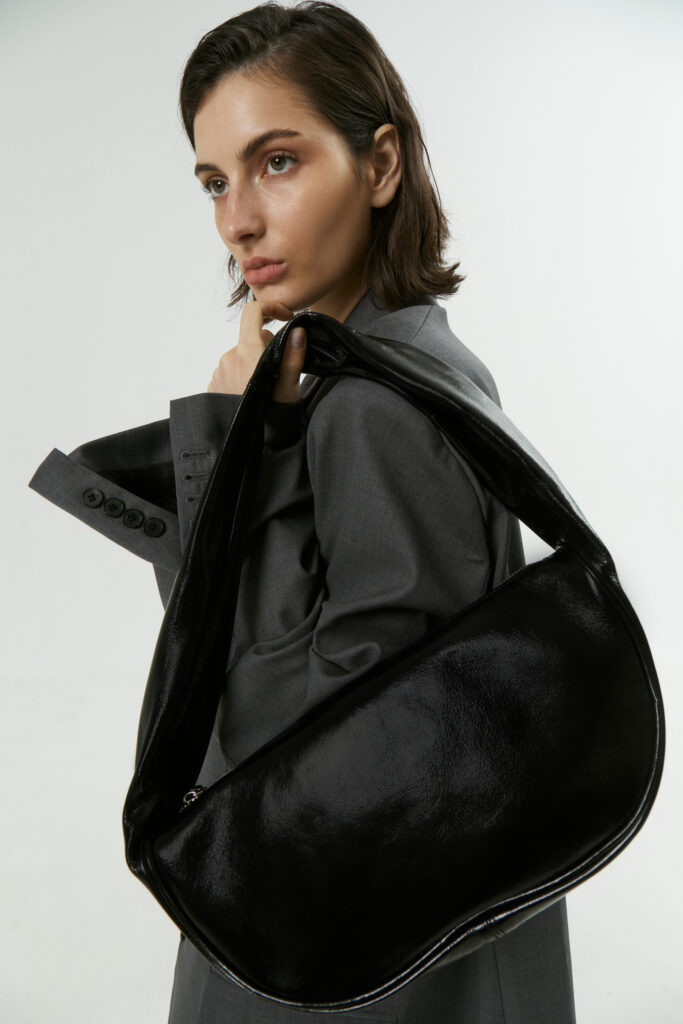 Glossy half moon leather bag