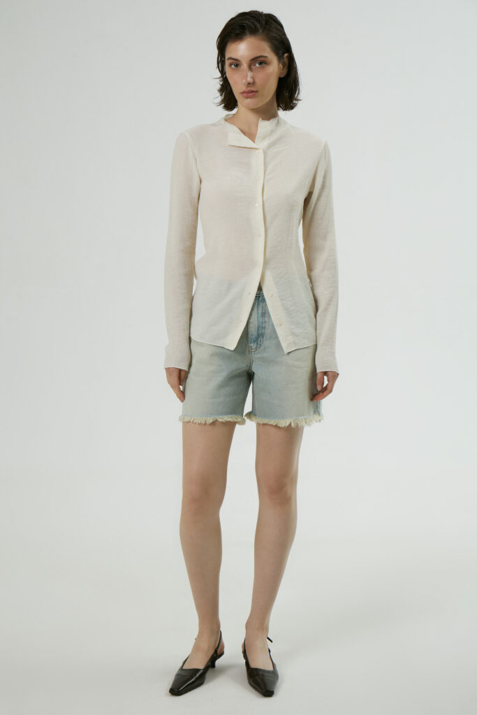 Raw-edge denim shorts
