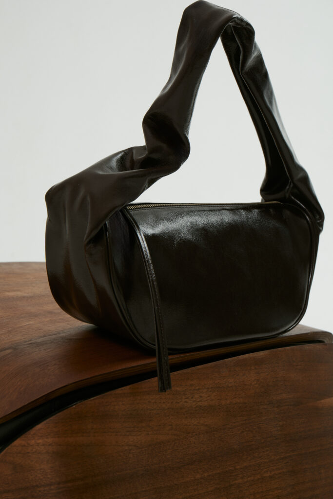 Glossy half moon leather bag