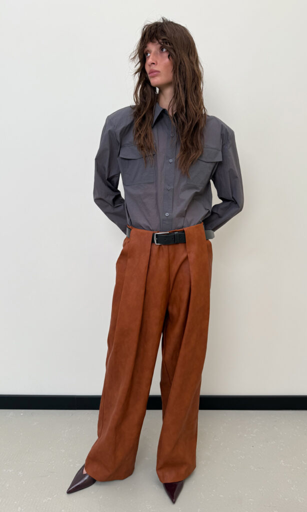 Belted tuck faux leather pants